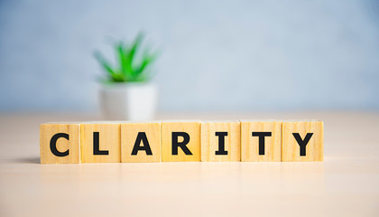 CLARITY word written on wood block, business concept.