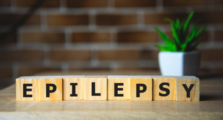 EPILEPSY word on wooden cubes, background. Concept of epilepsy awareness