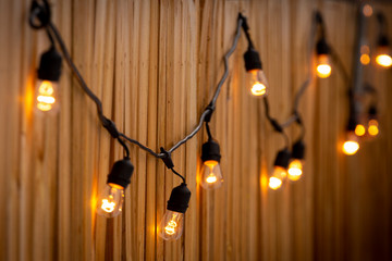 String of lights on wooden fence