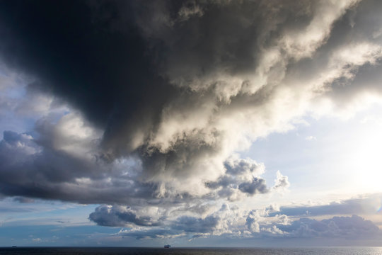 Picturesque dramatic stormy Cumulonimbus Calvus cloud formation over the Baltic sea near Helsinki, Finland. Landscape with dramatic sky over the sea