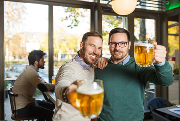 Friends in pub with glass of beer