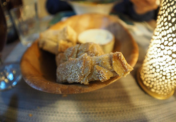 Bread appetizer, loafs of bred inside basket
