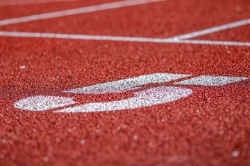 Red running sport track background and texture. Sport running track concept.