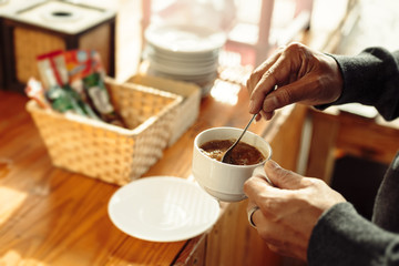 A man and coffee cup in the morning.