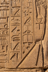 Luxor Governorate, Egypt, Karnak Temple, complex of Amun-Re. Embossed hieroglyphics on columns and walls.