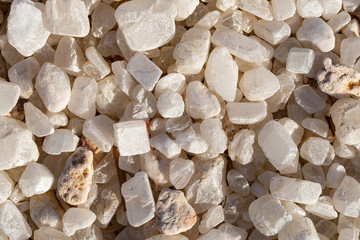 Quartz is a hard, crystalline mineral. White transparent pebbles, for decorating exteriors.