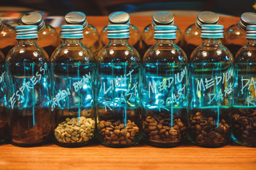 Coffee seed in bottle on the table.