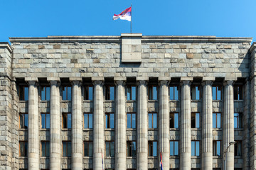 Serbian flag above government building in Belgrade