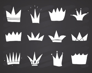 Crowns doodles set, hand drawn royal sketch, Vector Illustration on chalkboard background
