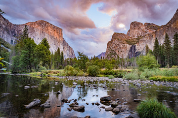 Vanilla Sky Sunset on Yosemite Valley reflecting in the calm water of Merced River, Yosemite National Park, California, USA. - obrazy, fototapety, plakaty