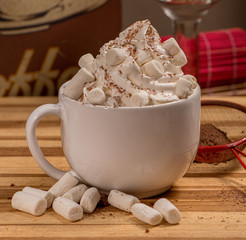 cup of coffee and cookies on wooden table