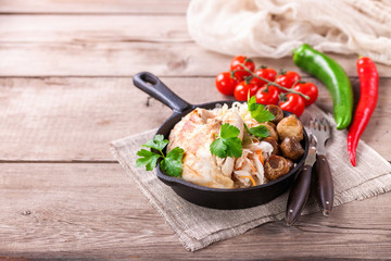 Chicken fillet, cabbage and mushrooms lunch. Selective focus. Copy space.