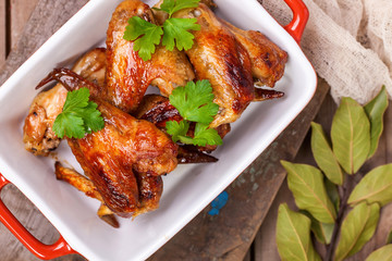 The baked chicken wings. Selective focus. Top view.