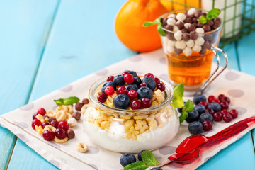 Yogurt with cereal and berries. Selective focus. Copy space