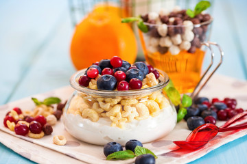Yogurt with cereal and berries. Selective focus. Copy space