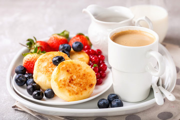 Cottage cheese pancakes with berries. Selective focus. Russian cheesecakes. Copy space