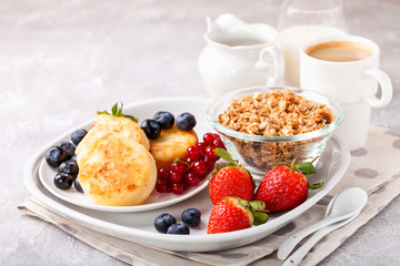 Cottage cheese pancakes with berries. Selective focus. Russian cheesecakes. Copy space