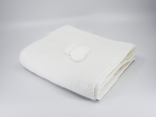 bath additives on top of fluffy towel