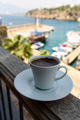 Old port of Kaleici from the restaurant with a cup of strong and hot Turkish coffee, Antalya, Turkey.