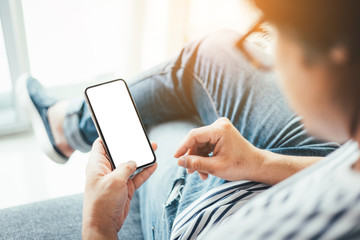 Mockup image blank white screen cell phone.man hand holding texting using mobile.background empty space for advertise text.people contact marketing business,technology 