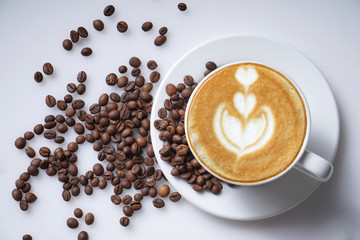 Cup of coffee latte art and coffee beans fresh and natural clean on white 