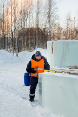 Portrait of a fitter in an orange vest