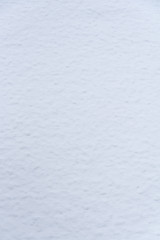 Fresh, wet, heavy snow as a monochrome white nature background