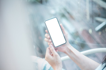 Mockup image blank white screen cell phone.man hand holding texting using mobilebackground empty space for advertise text.people contact marketing business,technology 