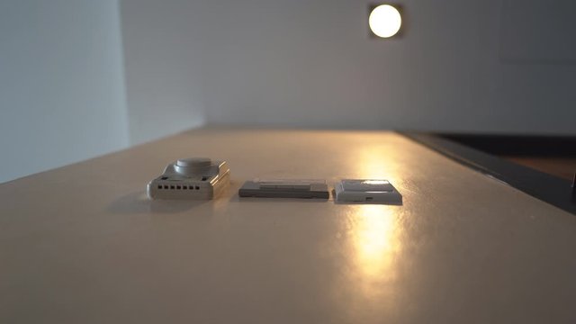 Down view hand holding key card insert box card for open and close system in room