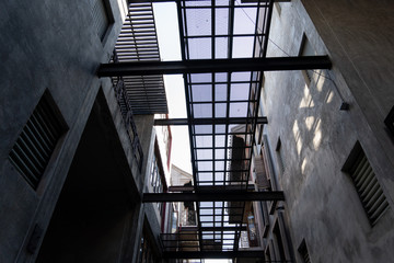 Fototapeta premium The sky in alley with loft architecture Concrete Cement style . Modern chinese loft architecture background