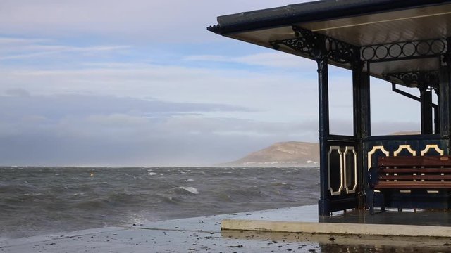 A British Victorian Beach Shelter In A Storm