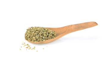 dried oregano flakes in the wooden spoon, isolated on white background