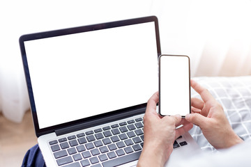 mockup image blank screen computer,cell phone with white background for advertising text,hand woman using laptop texting mobile contact business search information on desk in cafe.marketing,design