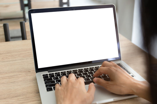 mockup image blank screen computer with white background for advertising text,hand man using laptop contact business search information sittings at coffee shop.marketing and creative design