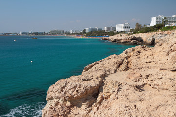 Fototapeta premium Sea, rocky coast and resort city. Agia Napa, Cyprus