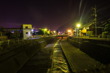 water stream in city at night