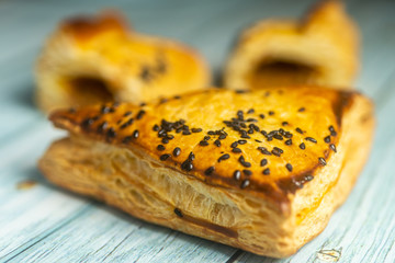 Fresh Puff Pastries on Woodn Background. Selective Focusing, Shallow depth of field.