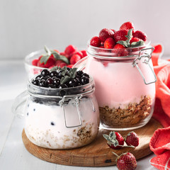 Fresh fruit yogurt with raspberries, blueberries and strawberry