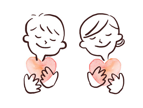 couple hugging a heart and smiling