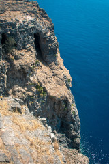 high powerful cliff and deep blue sea