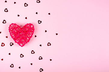 Pind wooden heart composition on colored background, party and celebration decoration.