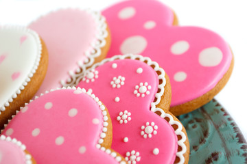 Set of pink heart shaped cookies with patterns, handmade