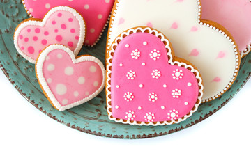 Set of pink heart shaped cookies with patterns, handmade