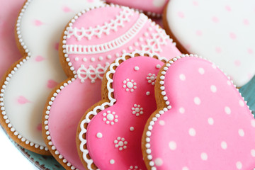 Set of pink heart shaped cookies with patterns, handmade