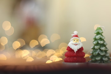 Selection of meat grilling over the coals on a portable barbecue with spicy sausages, beef kebabs and racks of ribs, outdoors on green grass with copyspace