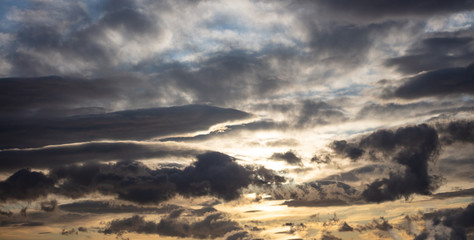 Sunrise clouds. Dramatic magical sunset over orange cloudy sky