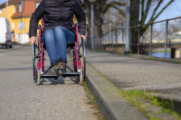 Obraz premium Feet of a disabled woman seated in a wheelchair