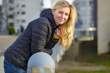 Attractive friendly blond woman in town