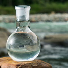 Glass flask with clean drinking water.