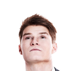 Obraz premium closeup.young man looking up at copy space